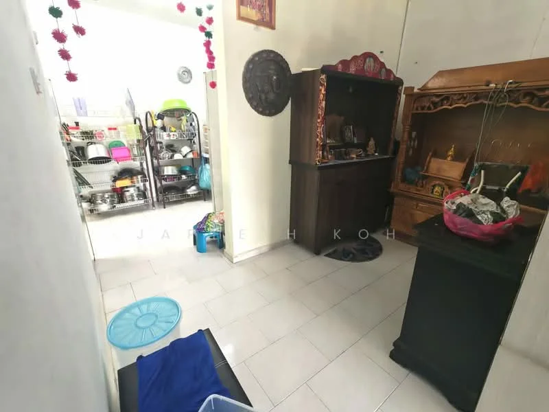 Room features: white painted walls, light-colored tile flooring, wooden cabinet, decorative wall mirror, shelves with kitchenware, blue laundry basket, black storage cabinet, decorative items on cabinet.
