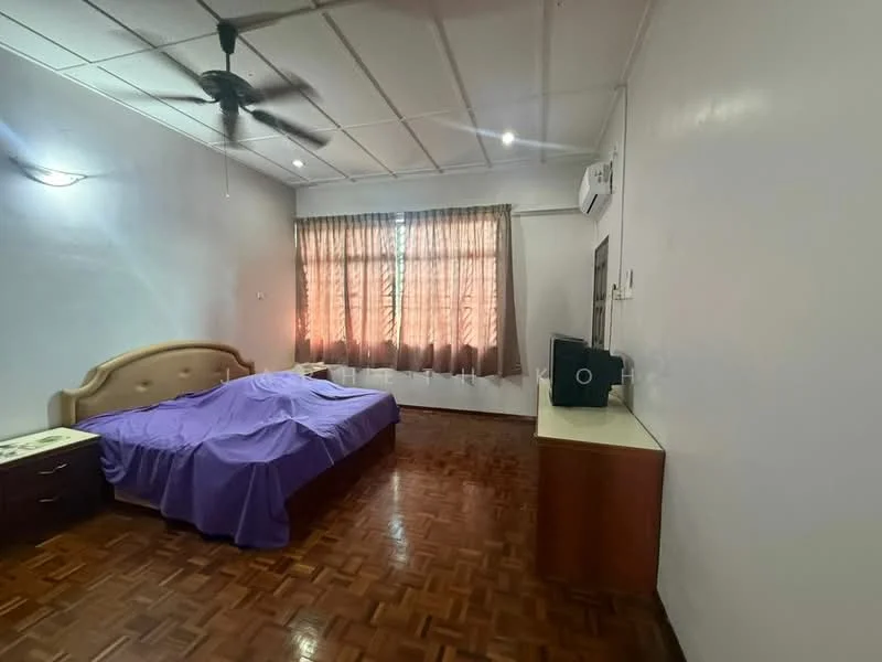 Bedroom features: queen-size bed with purple bedding, wooden parquet flooring, white painted walls, ceiling fan, window with sheer curtains, built-in wardrobe, side table, wall-mounted air conditioning unit, desk with speaker.