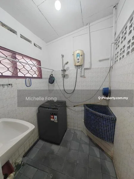 Laundry features: washing machine, blue mosaic tile sink, wall-mounted water heater, grey ceramic tile flooring, white tiled walls, window with metal grille, exposed plumbing, shelf above sink.