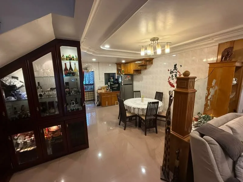 Dining features: round dining table, 6 dining chairs, wooden cabinetry, glass display cabinet, recessed ceiling lights, cream painted walls, marble tile flooring, decorative wall art, open layout to kitchen, sofa in adjacent living area; style: modern. Kitchen features: stainless-steel fridge, built-in oven, wooden cabinets, countertop space, kitchen island, ceramic tile backsplash; style: modern.