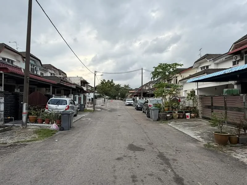 Exterior type: linked terrace house; features: residential street, two-storey linked terrace houses, paved road, street lighting, garbage bins, parked cars, front gardens with potted plants, overcast sky; style: modern.