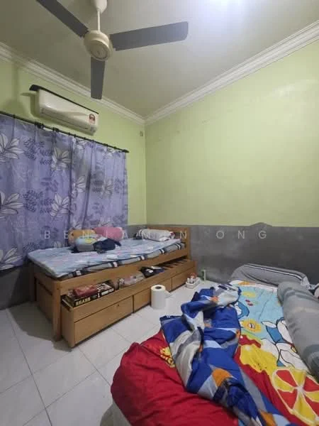 Bedroom features: two single beds with bedding, light green painted walls, grey accent wall, white ceiling with crown moulding, 5-blade ceiling fan, wall-mounted split AC unit, curtains with floral pattern, tiled flooring, wooden bed frames, nightstand with items, decorative items on floor.