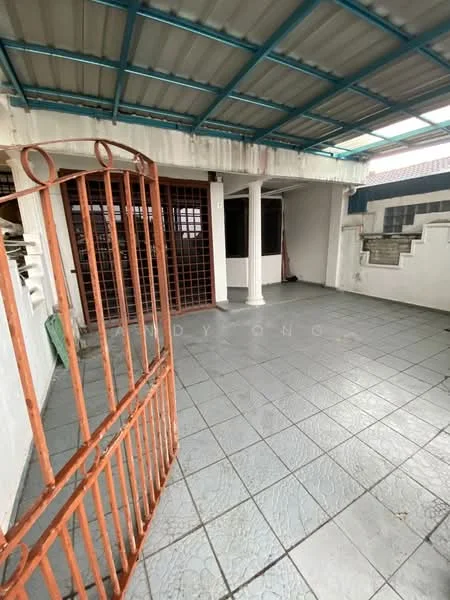 Room features: grey tiled flooring, metal roof with blue frame, white painted walls, iron gate, columns, open space, natural light from roof, no visible furniture.