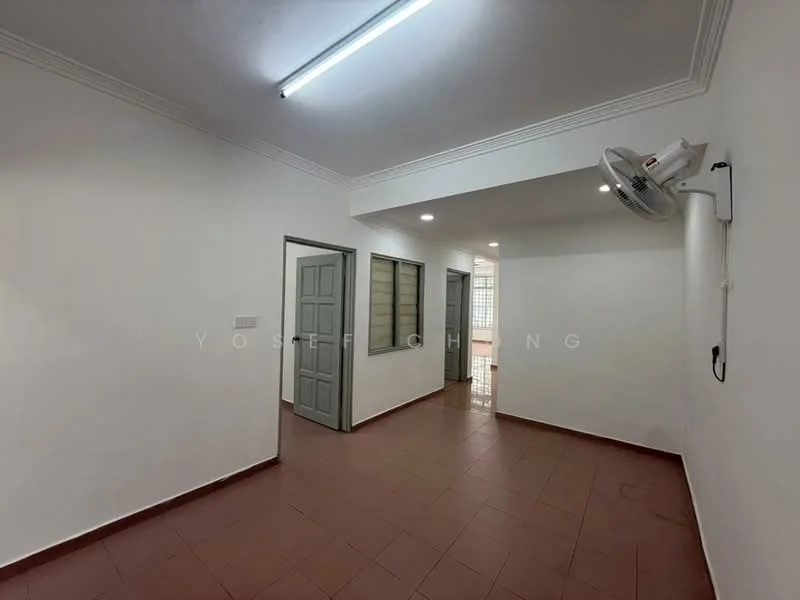 Room features: white painted walls, red ceramic tile flooring, ceiling with recessed lighting, wall-mounted split AC, two grey doors, one window with metal grille, neutral color scheme, corner of room visible with light source; style: minimalist.