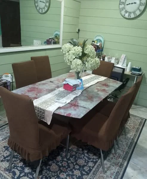 Dining features: rectangular dining table with marble top, 8 upholstered dining chairs in brown, decorative table runner, floral centerpiece, wall-mounted mirror, green painted walls, area rug with intricate pattern, wall clock; style: contemporary.
