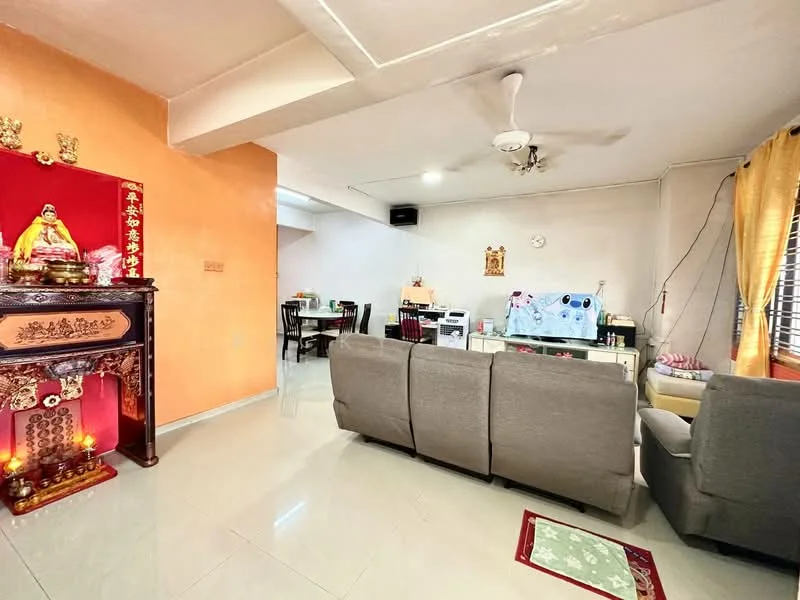 Living features: grey fabric sofa, coffee table, wall-mounted ceiling fan, cream tiled flooring, orange painted accent wall, white painted walls, decorative altar, window with sheer curtains, area rug, dining table with chairs in background; style: modern.
