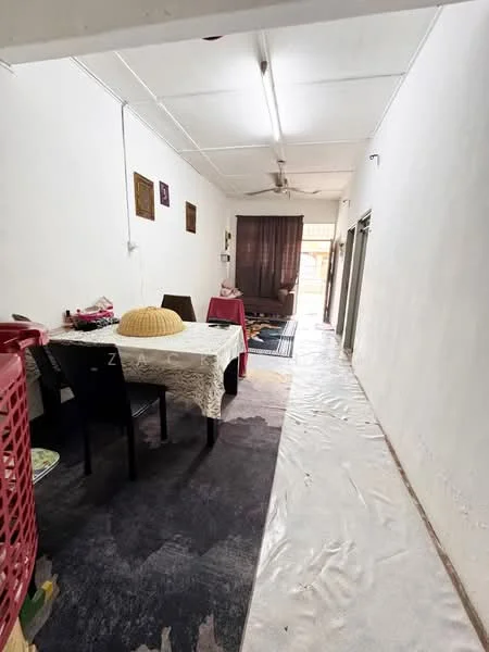 Dining features: dining table with tablecloth, black dining chairs, ceiling fan, white painted walls, laminate flooring, area rug, decorative wall art, curtains, light source from ceiling. Hallway features: white painted walls, laminate flooring, light source from ceiling.