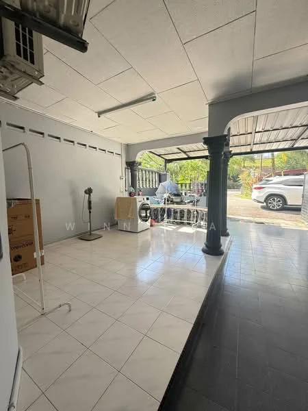 Room features: white tiled flooring, grey tiled flooring, exposed ceiling, ceiling fan, large windows, open layout, column supports, air conditioning unit, furniture including table and chairs, storage boxes; style: modern; view: garden.