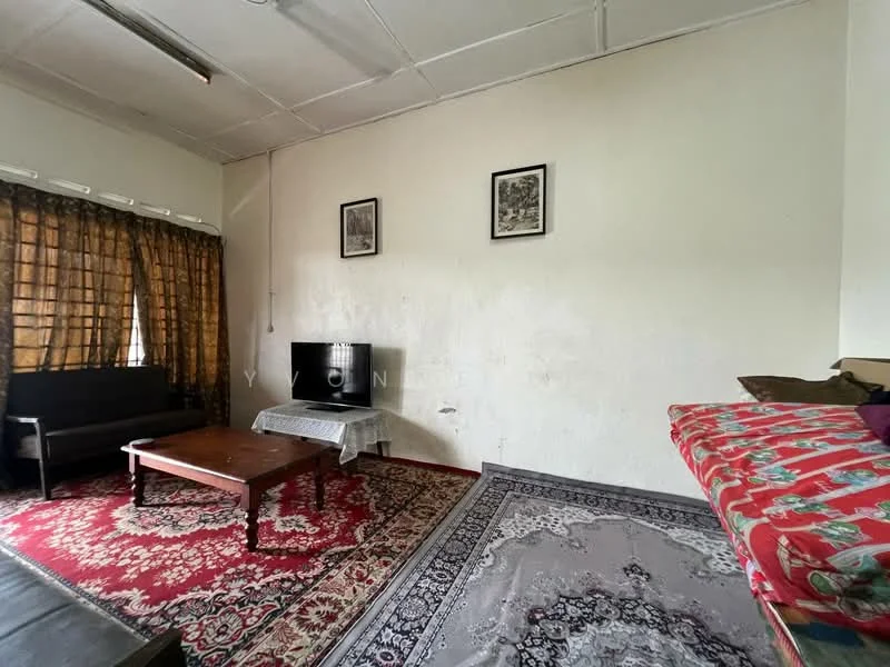 Living features: brown fabric sofa, wood coffee table, flat-screen TV on stand, decorative wall art, curtains with floral pattern, area rug with intricate design, light-colored painted walls, wooden flooring; style: traditional.
