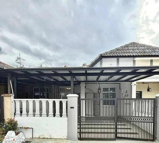 Exterior type: semi-detached house; features: grey painted facade, pitched tile roof, metal carport, white balustrade, black wrought iron gate, front garden with small plants, concrete driveway, single-storey, surrounded by residential area; style: modern.