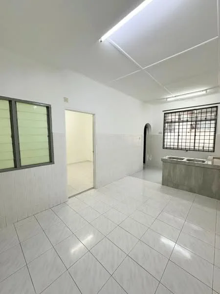 Kitchen features: white tiled walls, grey countertop, stainless-steel sink, single-bowl sink, window with green frames, floor-to-ceiling tiles, white ceramic tile flooring, recessed ceiling lights; style: modern. Room features: white painted walls, white ceramic tile flooring, doorway leading to another room.