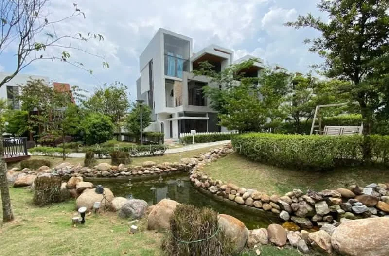 Exterior type: detached bungalow; features: landscaped garden, manicured lawn, mature trees, rock-lined pond, stone pathway, modern facade, multiple balconies, large windows, outdoor seating area, surrounding greenery; style: modern.