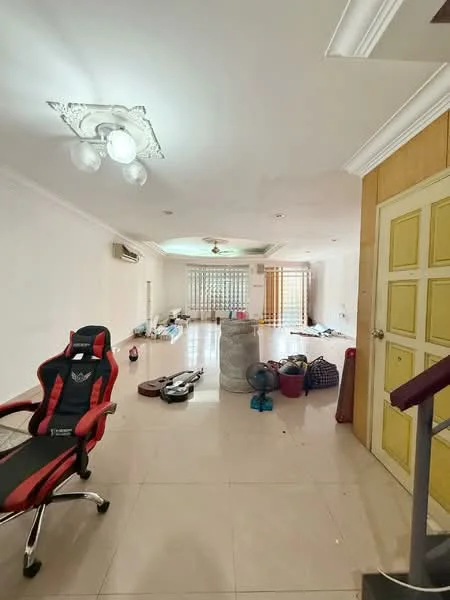 Room features: white painted walls, glossy tile flooring, tray ceiling with light fixture, 1 wall-mounted split AC, large windows with sheer curtains, open space layout, decorative column, various personal items scattered, staircase visible in the background, office chair, multiple bags and items on the floor; style: modern.