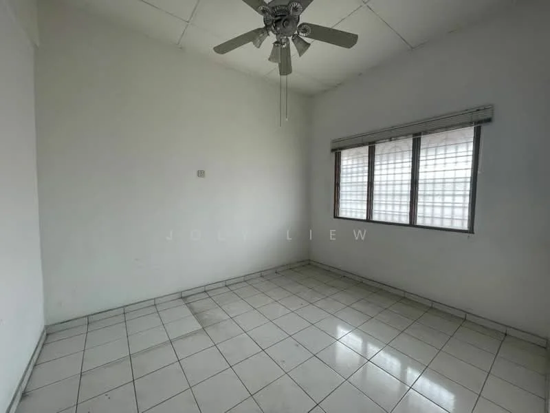 Room features: white painted walls, tile flooring, ceiling fan, window with grid pattern, natural light from window.