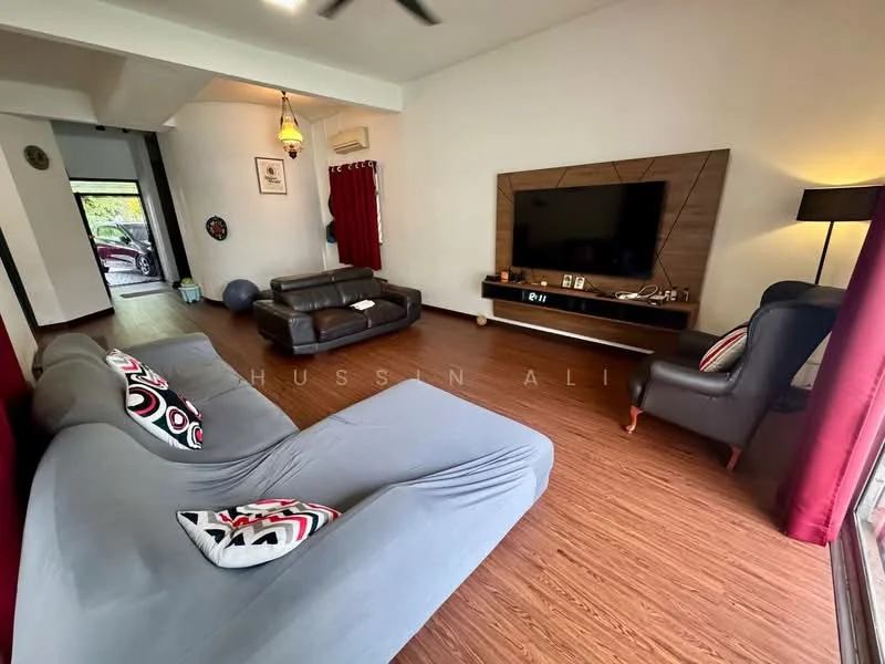 Living features: grey fabric L-shape sectional sofa, black leather 2-seater sofa, wooden TV console, wall-mounted flat-screen TV, wooden flooring, red curtains, decorative cushions with patterns, ceiling fan, floor lamp, framed artwork on wall, large windows with natural light; style: modern; view: garden.