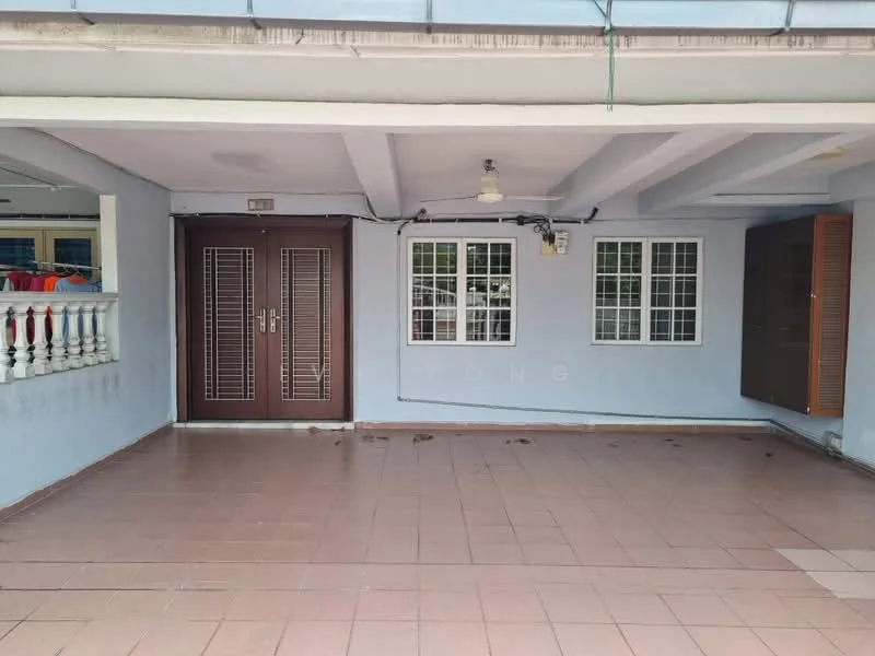 Exterior type: linked terrace house; features: tiled flooring, blue painted walls, two wooden doors with louvered design, three windows with white grills, overhead ceiling light, balustrade with white columns, exposed ceiling beams; style: modern.