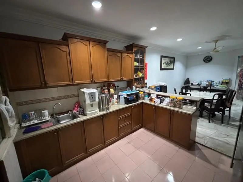Kitchen features: brown wooden cabinetry, granite countertop, single-bowl stainless-steel sink, chrome pull-down faucet, built-in kitchen appliances, microwave, coffee machine, toaster, kettle, ceramic tile flooring, recessed downlights, wall-mounted clock, open shelving, dining table in adjacent area, ceiling fan; style: traditional.