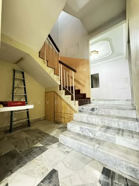 Room features: marble flooring, staircase with wooden railing, painted walls in beige, ceiling with light fixture, wooden paneling on wall, ladder against wall, open space, natural light from upper level; style: modern.