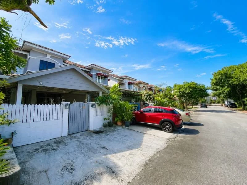 Exterior type: linked terrace house; features: white painted facade, gated entrance, manicured lawn, paved driveway, surrounded by greenery, two-storey structure, red car parked, clear blue sky; style: modern.
