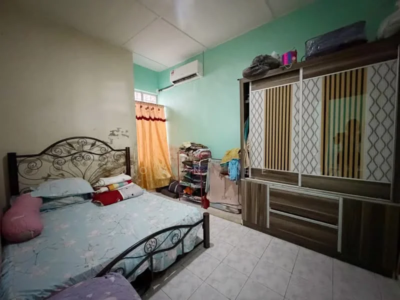 Bedroom features: queen-size bed with floral bedding, metal bed frame, built-in wardrobe with sliding doors, light green painted walls, white tiled flooring, window with sheer curtains, air conditioning unit, clothes rack, decorative pillows, wall-mounted shelf.