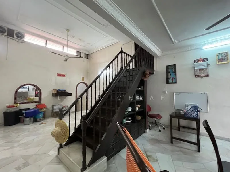 Room features: marble flooring, staircase with wooden railing, white painted walls, ceiling fan, wall-mounted air conditioning units, decorative wall mirror, wooden shelves, study desk, red office chair, various storage boxes, open space layout; style: traditional.