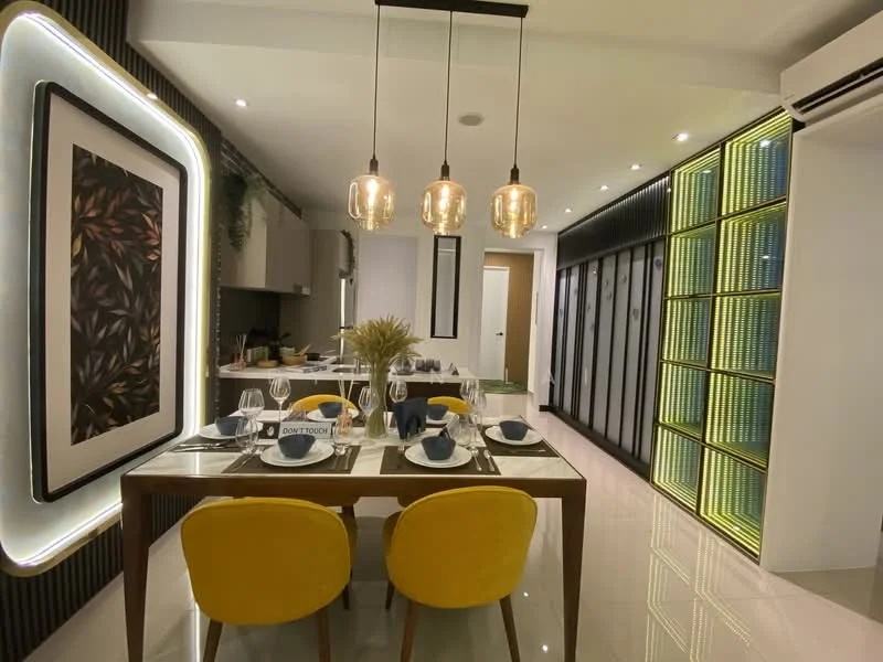 Dining features: dining table with 4 chairs, yellow upholstered chairs, decorative centerpiece with dried flowers, table setting with plates and cutlery, wall-mounted artwork with floral design, recessed ceiling lights, pendant lights with glass shades, glossy tile flooring, built-in cabinetry with glass doors, green accent lighting, neutral wall color, open layout to kitchen; style: modern.