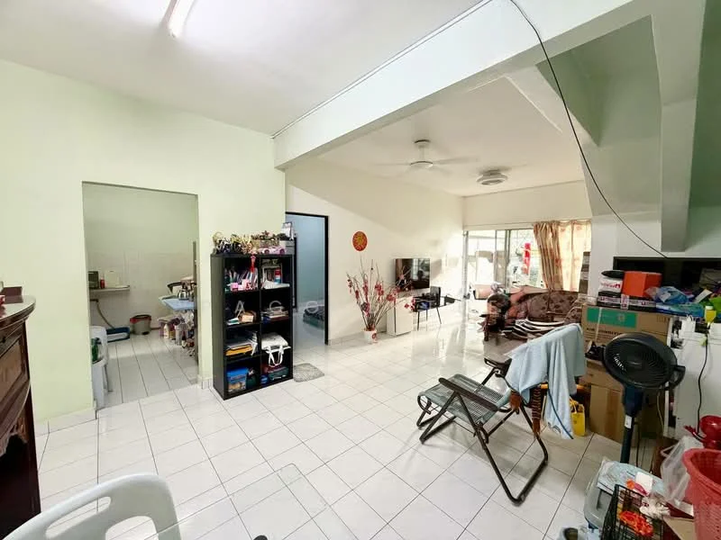 Living features: white painted walls, glossy tile flooring, ceiling fan, sofa, coffee table, TV console, wall-mounted TV, decorative plants, large windows with sheer curtains. Kitchen features: white tiled walls, ceramic tile flooring, kitchen cabinets, sink, stainless-steel appliances, open layout to living area.