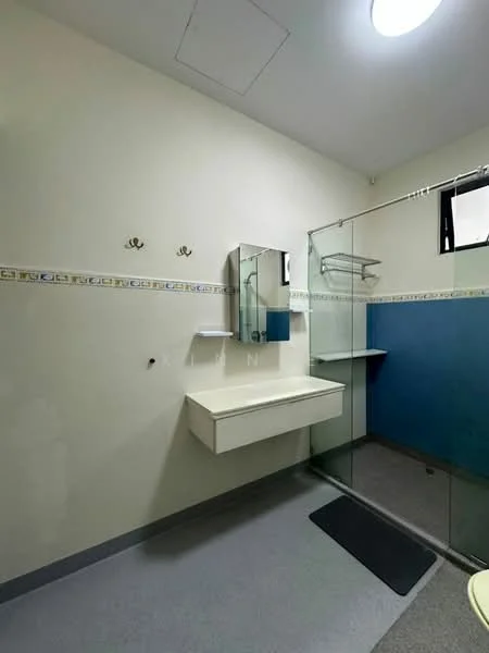 Bathroom features: single-sink vanity with white cabinet, framed mirror, glass shower enclosure, handheld shower, tile cladding on walls, blue accent wall, grey vinyl flooring, wall-mounted shelves, towel hooks, recessed ceiling light; style: modern.