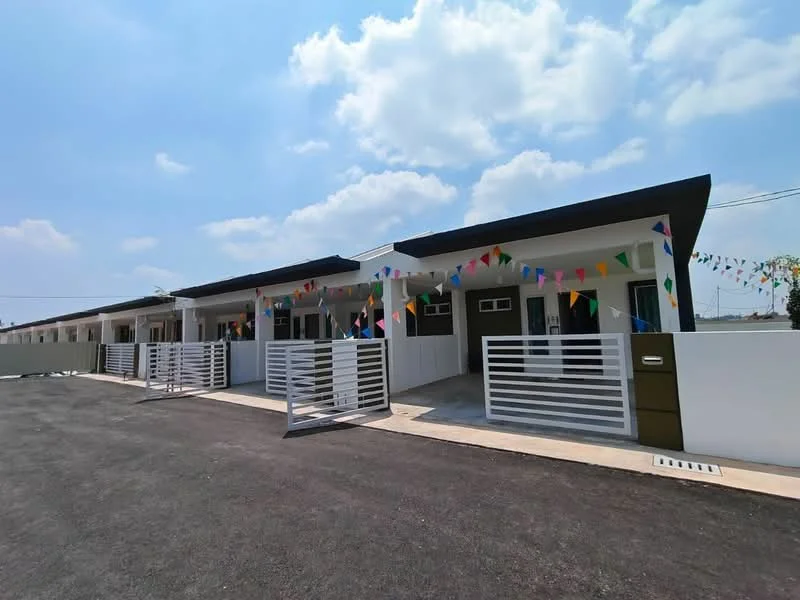 Exterior type: linked terrace house; features: white painted facade, flat roof, approximately single-storey, decorative bunting, fenced front yard, concrete driveway, manicured landscaping, multiple entrances, modern design; style: modern.