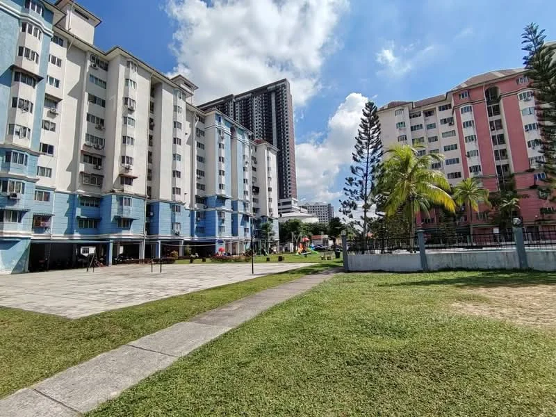 Exterior type: low-rise apartment block; features: blue painted facade, white painted facade, 3-storey low-rise, manicured lawn, paved walkway, mature trees, children's playground, surrounded by greenery; style: modern.