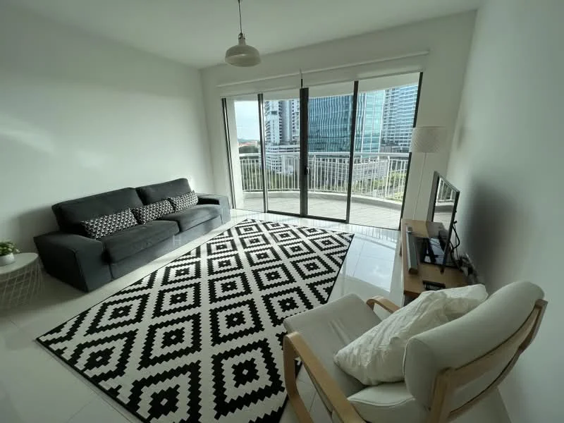 Living features: grey fabric 3-seater sofa, black and white geometric area rug, floor-to-ceiling windows, sliding glass door, white painted walls, white ceiling, light fixture, TV console, wall-mounted TV, decorative plant, wooden armchair; style: modern; view: city.