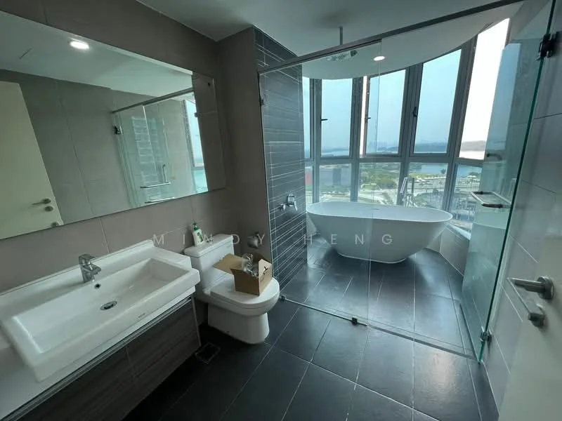 Bathroom features: freestanding bathtub, walk-in shower with glass enclosure, chrome basin mixer faucet, double-sink vanity with white cabinet, framed mirror, one-piece toilet, grey tile flooring, grey accent wall, floor-to-ceiling windows, city view; style: modern; view: city.