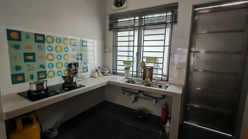 Kitchen features: white tiled walls, black tile flooring, L-shaped countertop, stainless-steel sink, chrome pull-down faucet, gas stove with two burners, kitchen cabinets, window with metal grilles, exhaust fan, kitchen utensils on countertop; style: modern.