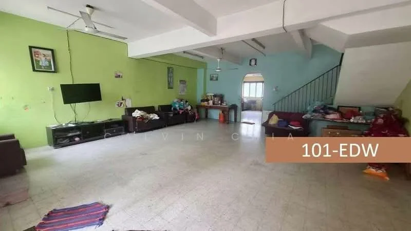 Living features: green painted walls, light green painted walls, tile flooring, 2 ceiling fans, TV mounted on wall, black TV console, sofa seating, decorative wall art, windows with natural light, staircase visible in background.