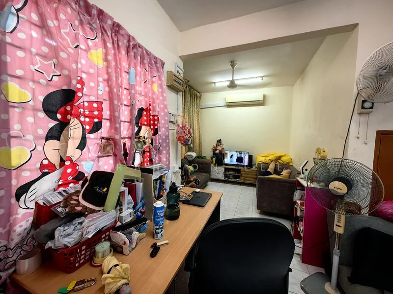 Living features: pink curtains with cartoon character design, wooden desk, black office chair, multiple fans, sofa in grey, television on stand, decorative items on desk, light-colored walls, tile flooring, ceiling fan, wall-mounted air conditioning unit.