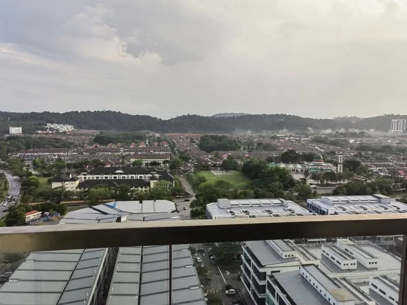 Exterior type: high-rise condominium; features: city skyline view, surrounded by greenery, adjacent to residential area, visible parking lots, multi-storey buildings in the foreground, hills in the background; style: modern.