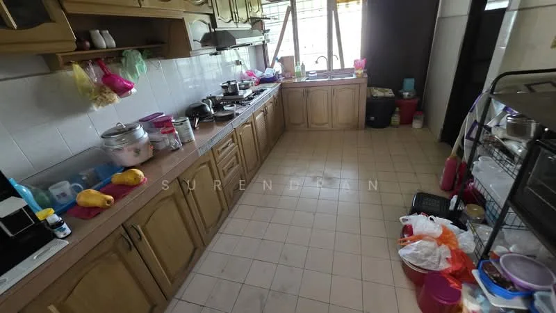 Kitchen features: wood cabinetry, ceramic tile flooring, stainless-steel sink, freestanding gas stove, exhaust hood, countertop with clutter, multiple storage containers, window with natural light, kitchen utensils, microwave, rice cooker, plastic bags, various kitchen appliances.