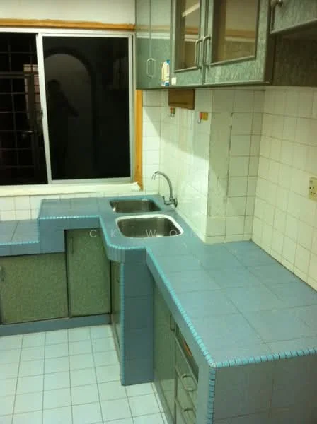 Kitchen features: blue tiled countertops, double-bowl stainless-steel sink, chrome faucet, green cabinetry, white tiled walls, blue tiled flooring, window with grid pattern, corner countertop layout.