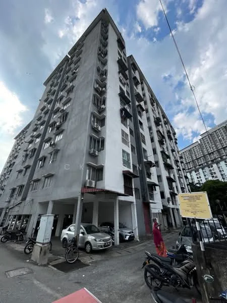 Exterior type: mid-rise condominium; features: grey painted facade, balconies with metal railings, multiple windows on each floor, ground-level parking area, surrounding vehicles, urban street context, visible signage, approximately 6-storey high-rise; style: modern.