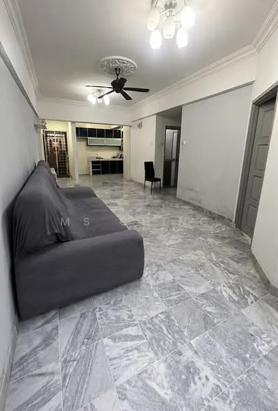 Living features: grey fabric sofa, marble flooring, 5-blade ceiling fan with light, recessed downlights, crown moulding, white painted walls, doorway to kitchen, open layout, single chair, large space, neutral decor; style: modern.