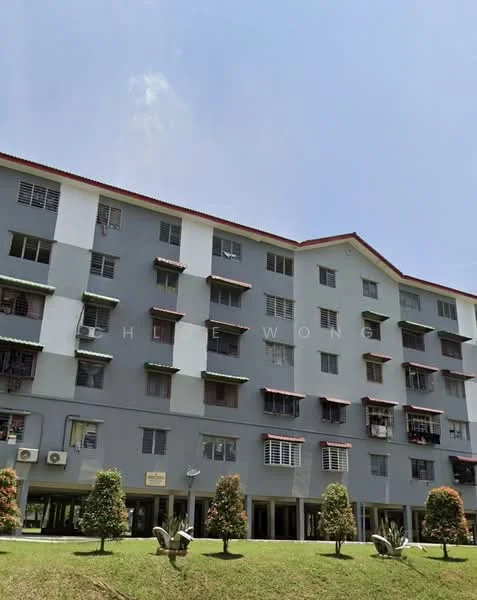 Exterior type: low-rise apartment block; features: grey painted facade, red tiled roof, multiple balconies, air conditioning units visible, landscaped lawn, mature trees in front; style: modern.