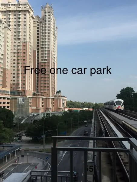 Exterior type: high-rise condominium; features: glass curtain wall, cream painted facade, recessed balconies, surrounded by mature greenery, adjacent to railway, open-air parking lot, multi-storey car park; style: modern.