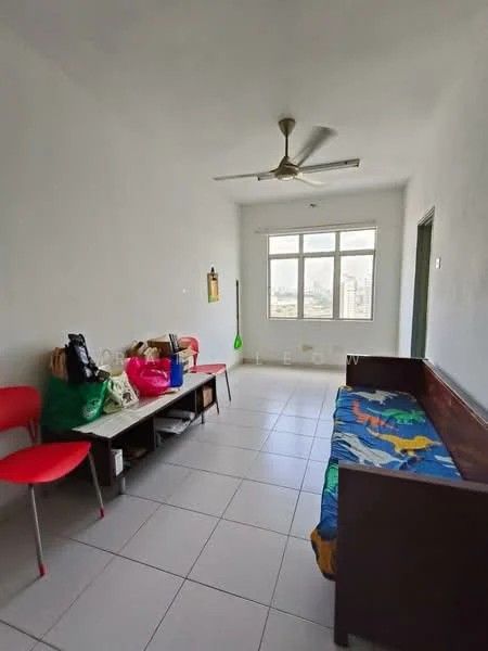 Living features: white painted walls, tiled flooring, 5-blade ceiling fan, large window with city view, wooden sofa, colorful bedspread, wooden coffee table, two red chairs, various bags and items on the table; view: city.
