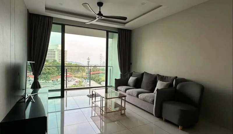 Living features: 3-seater fabric sofa in grey, glass coffee table, floor-to-ceiling windows, sliding glass door, grey painted walls, white ceiling, 5-blade ceiling fan, marble tile flooring, curtains, TV console, wall-mounted TV; style: modern; view: city.