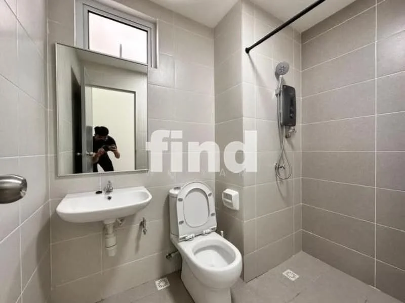 Bathroom features: grey tiled walls, grey tiled flooring, single-sink vanity with mirror, white toilet, shower area with wall-mounted shower head, chrome shower valve, toilet paper holder, soap dispenser; style: modern.
