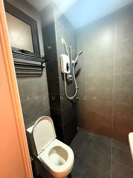 Bathroom features: grey tile flooring, dark grey wall tiles, white toilet, shower area with handheld shower, water heater mounted on wall, black towel rack, window for natural light, chrome shower faucet; style: modern.