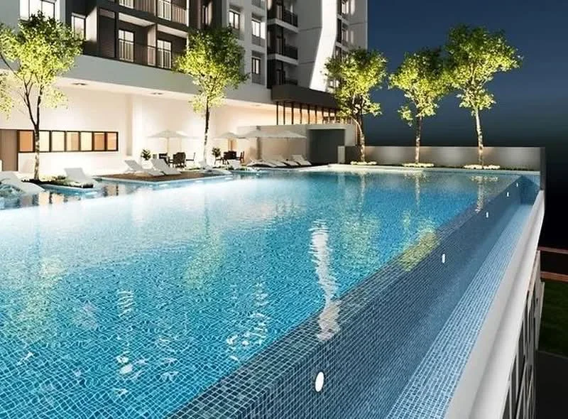 Exterior type: high-rise condominium; features: infinity pool, pool deck with loungers, landscaped area with trees, glass railing, night lighting, water feature, tile cladding around pool, surrounding building facade; style: modern.