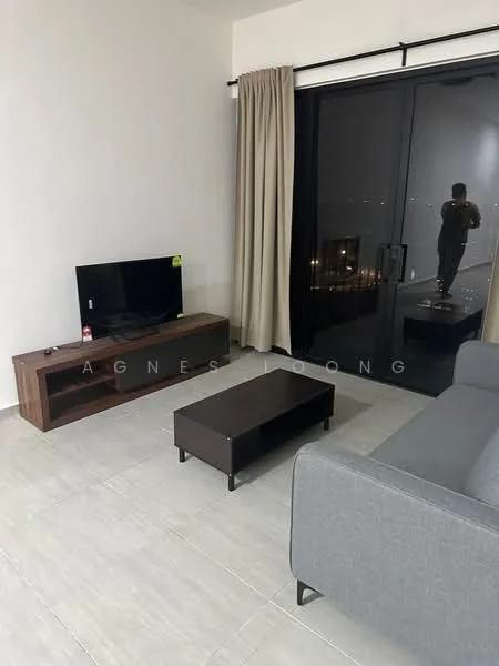 Living features: grey fabric sofa, wooden coffee table, TV console in dark wood, wall-mounted TV, floor-to-ceiling sliding glass door, sheer curtains, tile flooring, neutral painted walls; style: modern; view: city.