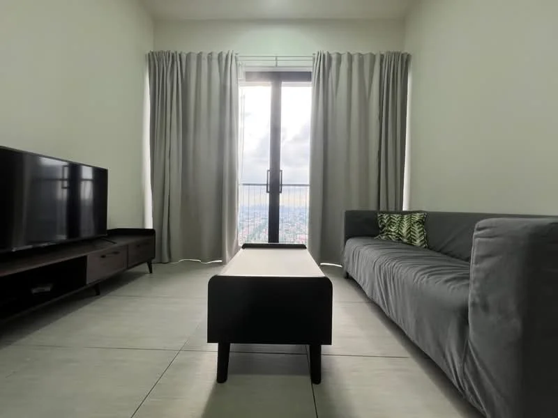 Living features: grey fabric sofa, black coffee table, wall-mounted TV, floor-to-ceiling windows, sheer curtains, light grey walls, tile flooring, decorative cushion with pattern; style: modern; view: city.