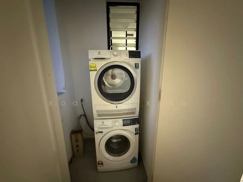Laundry features: stacked front-load washing machine, front-load dryer, white appliances, small window for ventilation, grey tiled flooring, wall-mounted electrical outlet, laundry basket, minimalist design; style: modern.